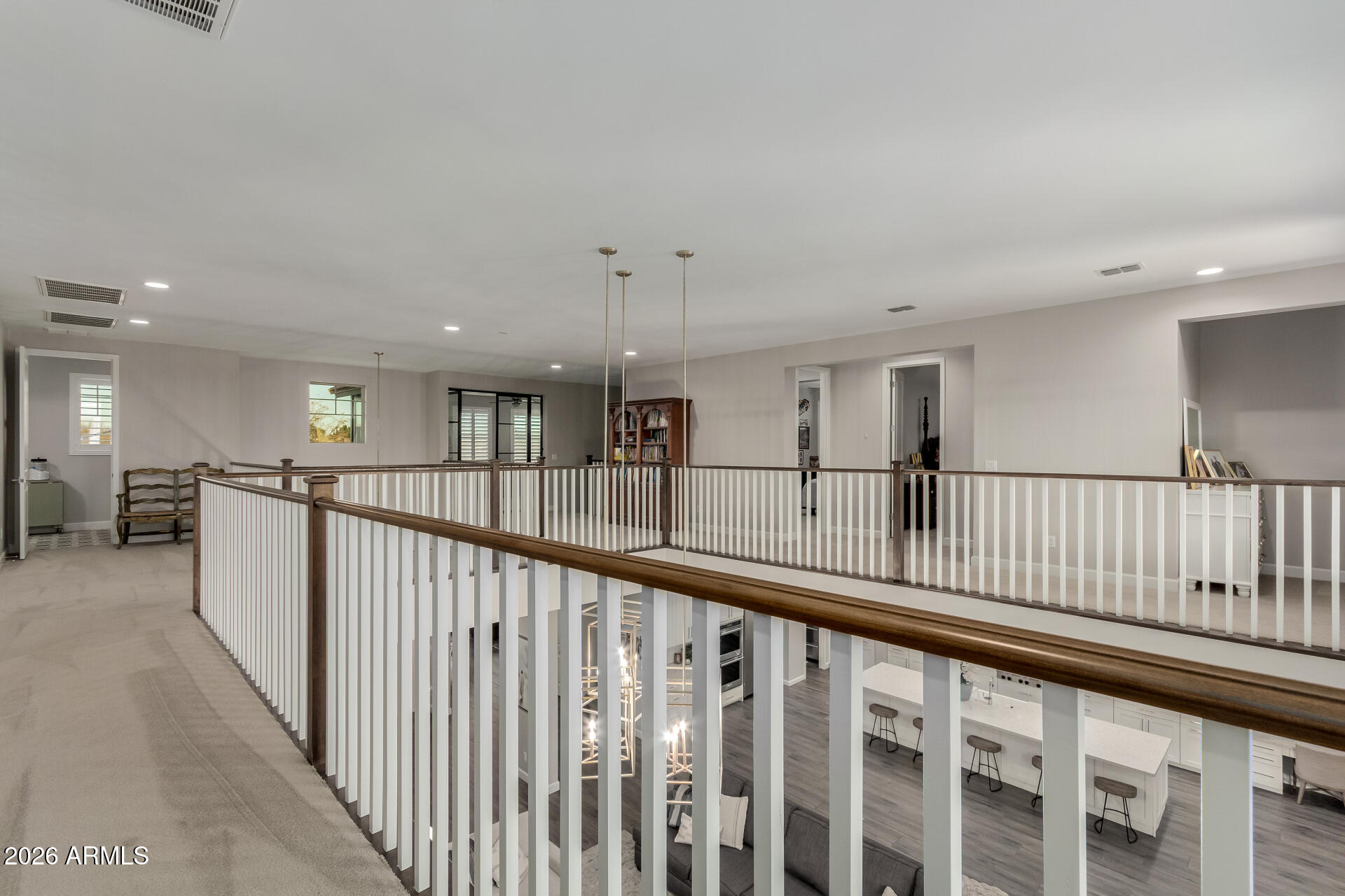 2917 East Boot Track Trail Gilbert, AZ 85296 - Photo 66 of 93 a view of a hallway with wooden floor stairs