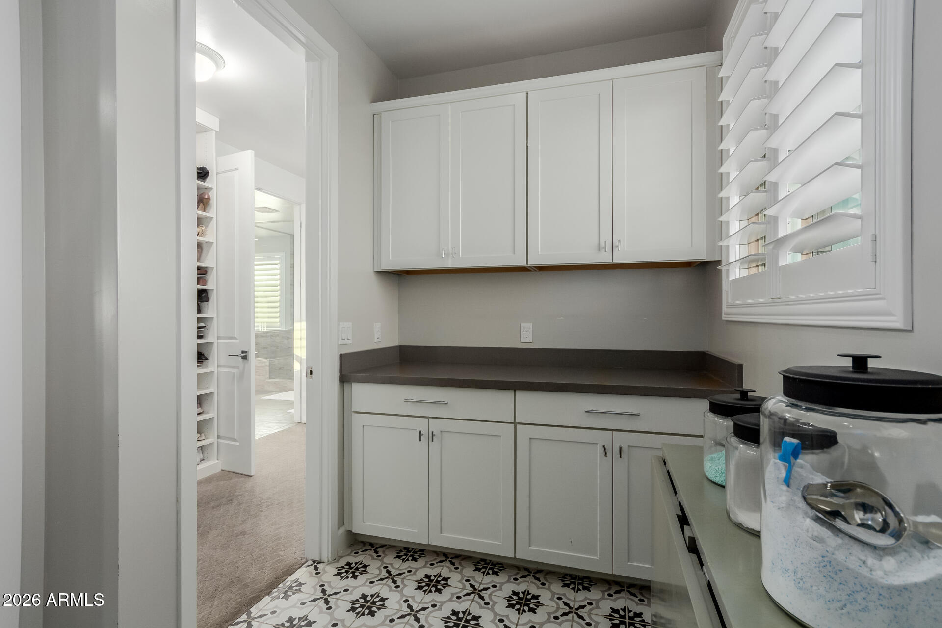 2917 East Boot Track Trail Gilbert, AZ 85296 - Photo 68 of 93 a kitchen with stainless steel appliances granite countertop a sink a stove and a refrigerator