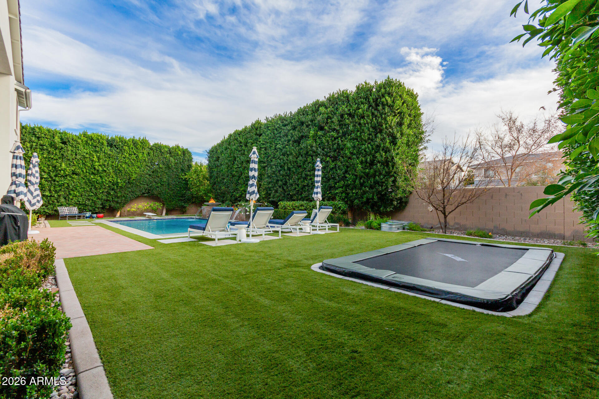 2917 East Boot Track Trail Gilbert, AZ 85296 - Photo 75 of 93 a view of a backyard with sitting area