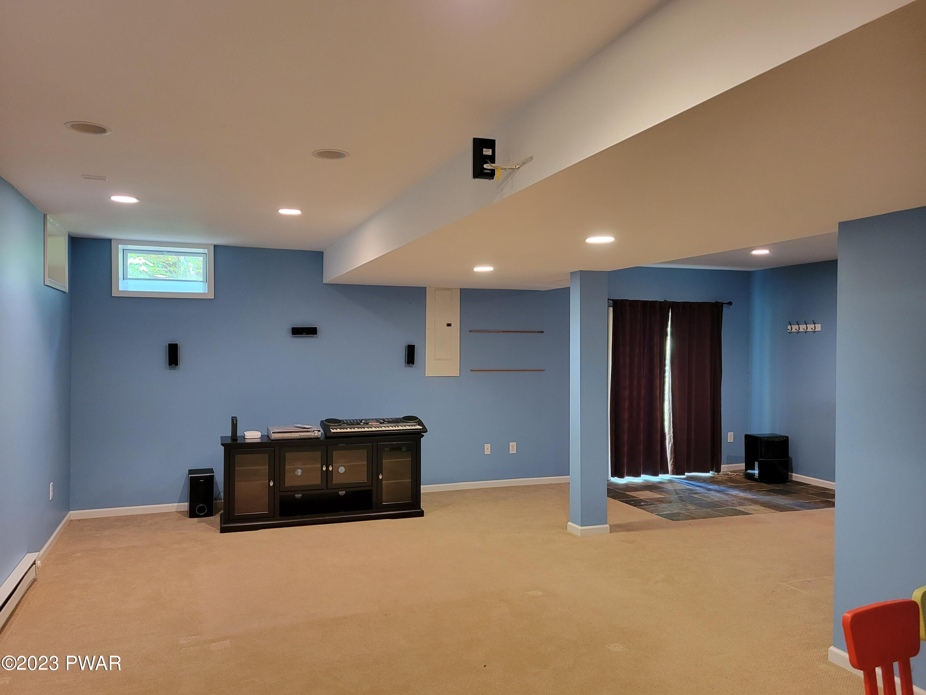 110 Rodeo Lane Hawley, PA 18428 - Photo 32 of 36 a view of an empty room with kitchen and window