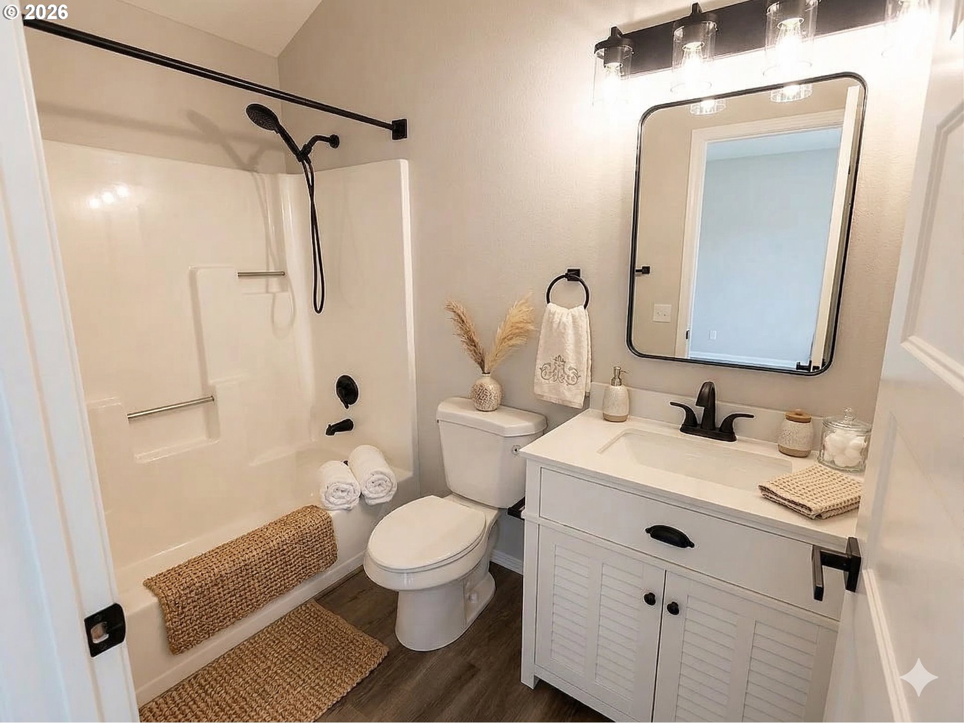 7025 Southwest 164th Terrace Beaverton, OR 97007 - Photo 11 of 28 a bathroom with a toilet sink and shower
