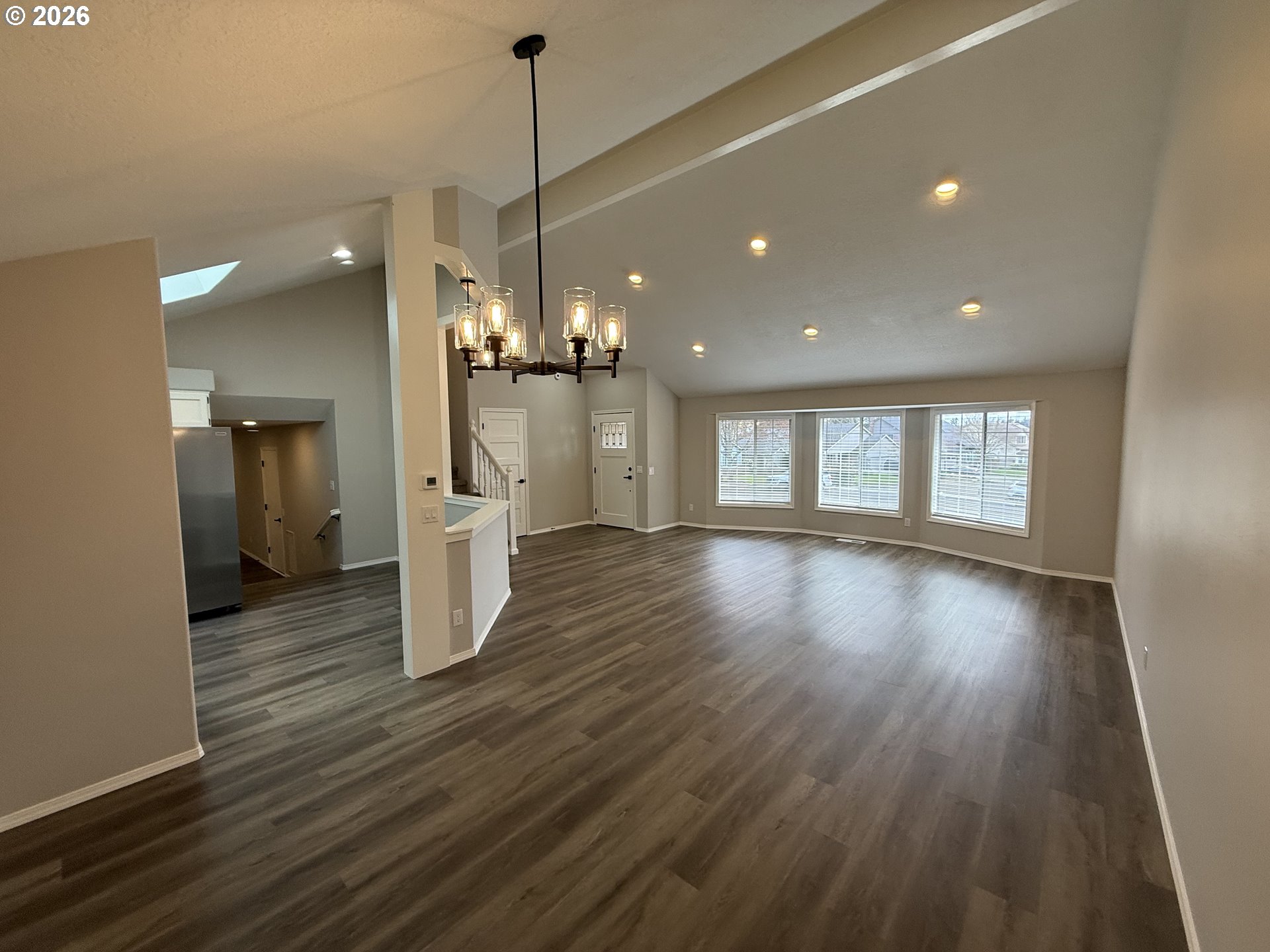 7025 Southwest 164th Terrace Beaverton, OR 97007 - Photo 14 of 28 a view of a room with wooden floor and window