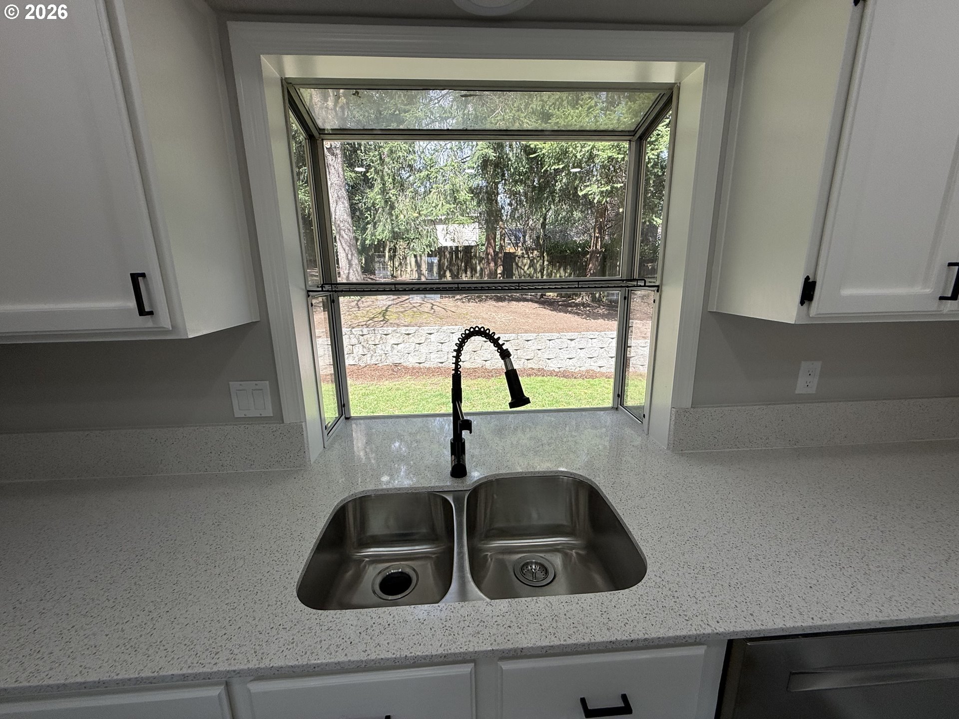 7025 Southwest 164th Terrace Beaverton, OR 97007 - Photo 16 of 28 a kitchen with a sink and a window