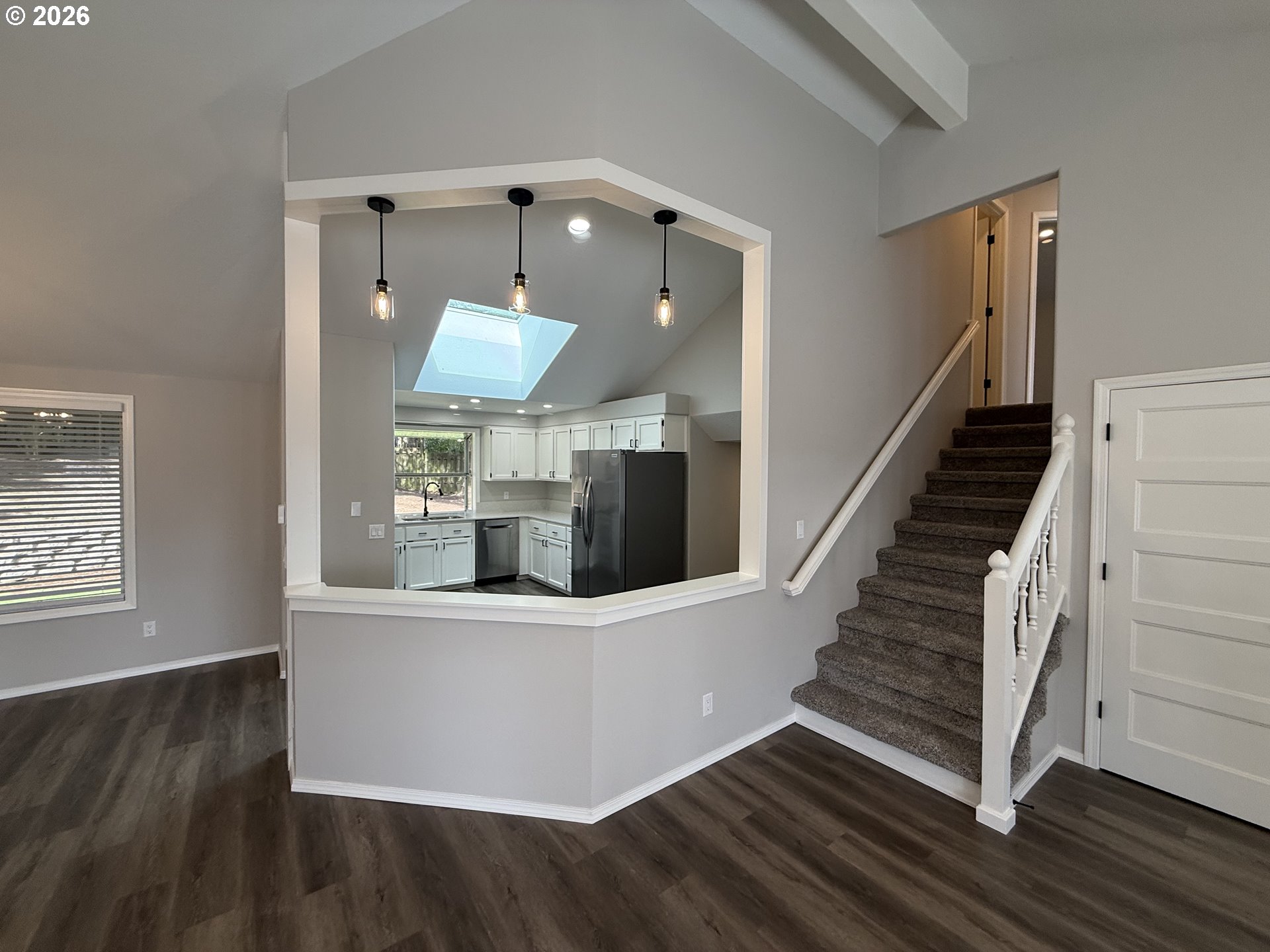 7025 Southwest 164th Terrace Beaverton, OR 97007 - Photo 18 of 28 a view of a living room with wooden floor and stairs