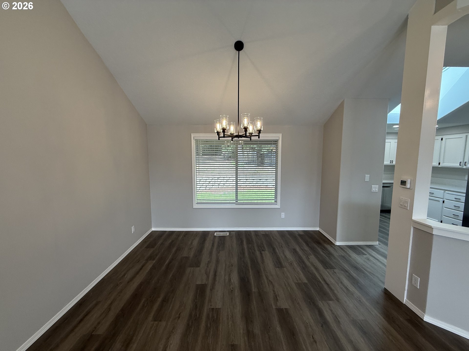 7025 Southwest 164th Terrace Beaverton, OR 97007 - Photo 19 of 28 a view of empty room with wooden floor and window