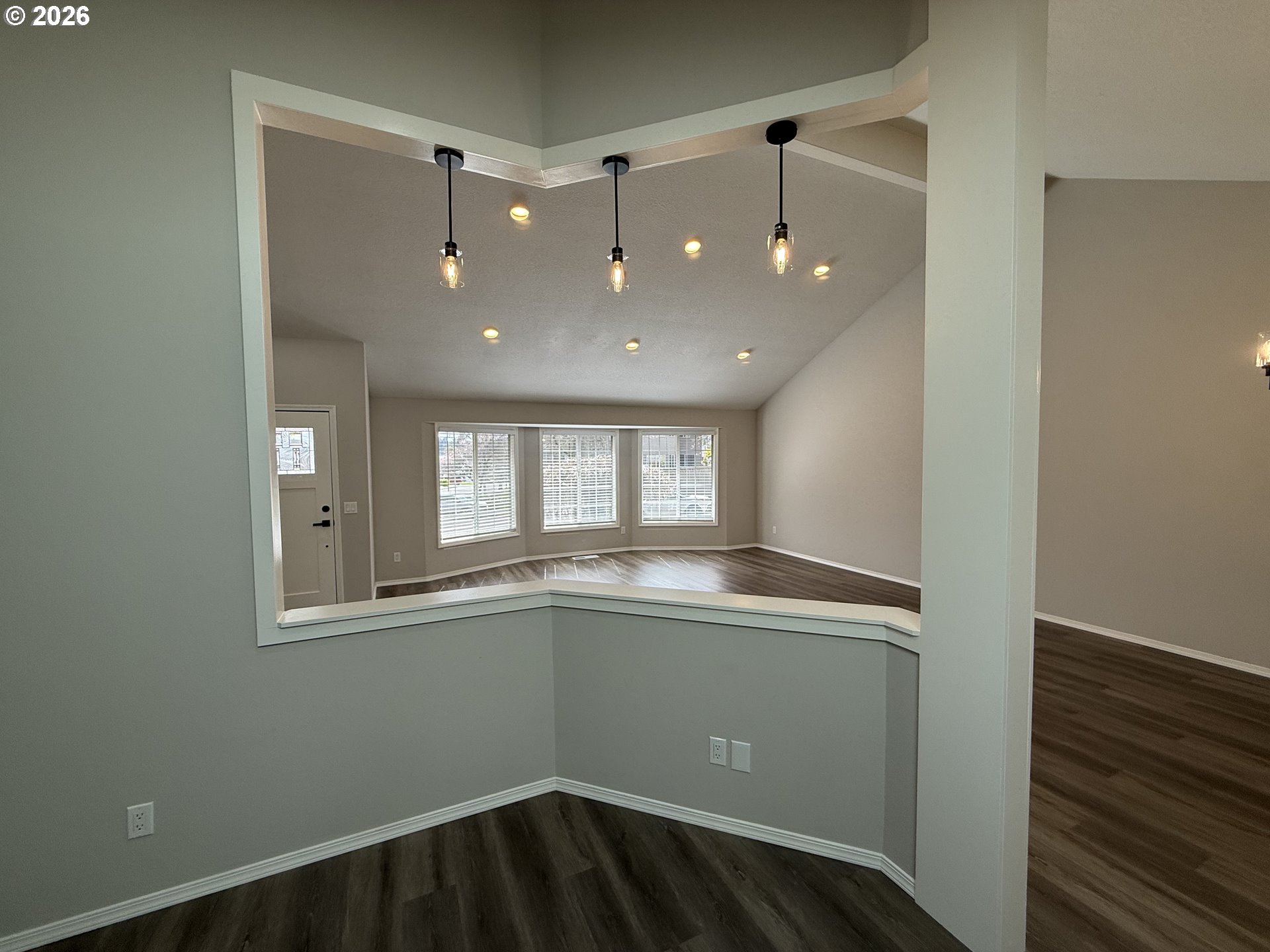 7025 Southwest 164th Terrace Beaverton, OR 97007 - Photo 20 of 28 an empty room with wooden floor and windows
