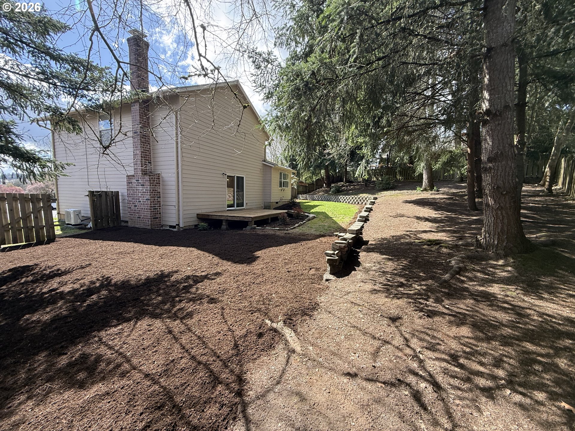 7025 Southwest 164th Terrace Beaverton, OR 97007 - Photo 24 of 28 a view of a backyard of the house