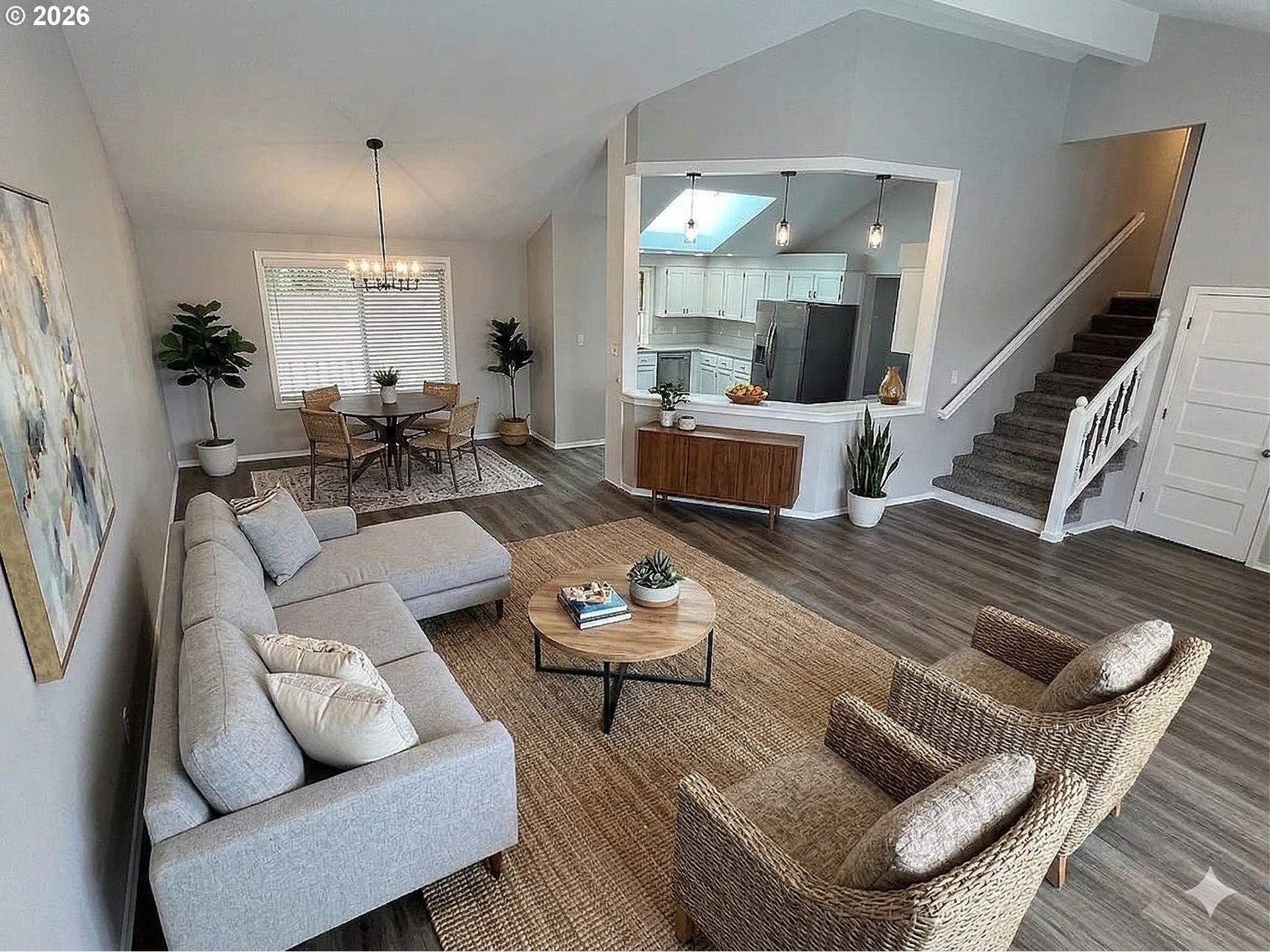 7025 Southwest 164th Terrace Beaverton, OR 97007 - Photo 3 of 28 a living room with furniture kitchen view and a chandelier