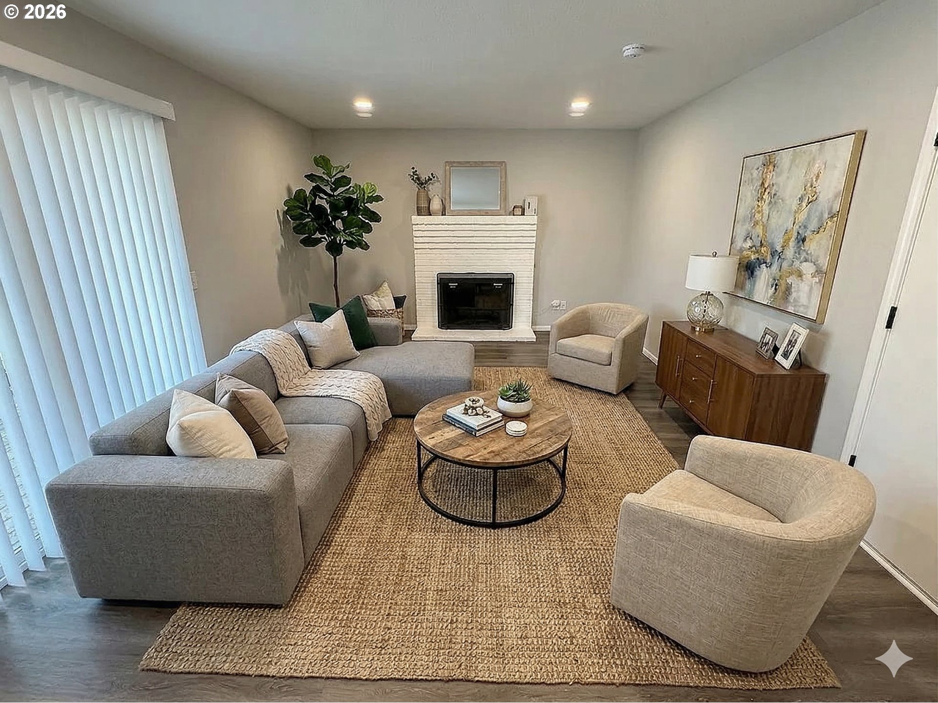 7025 Southwest 164th Terrace Beaverton, OR 97007 - Photo 5 of 28 a living room with furniture and a fireplace