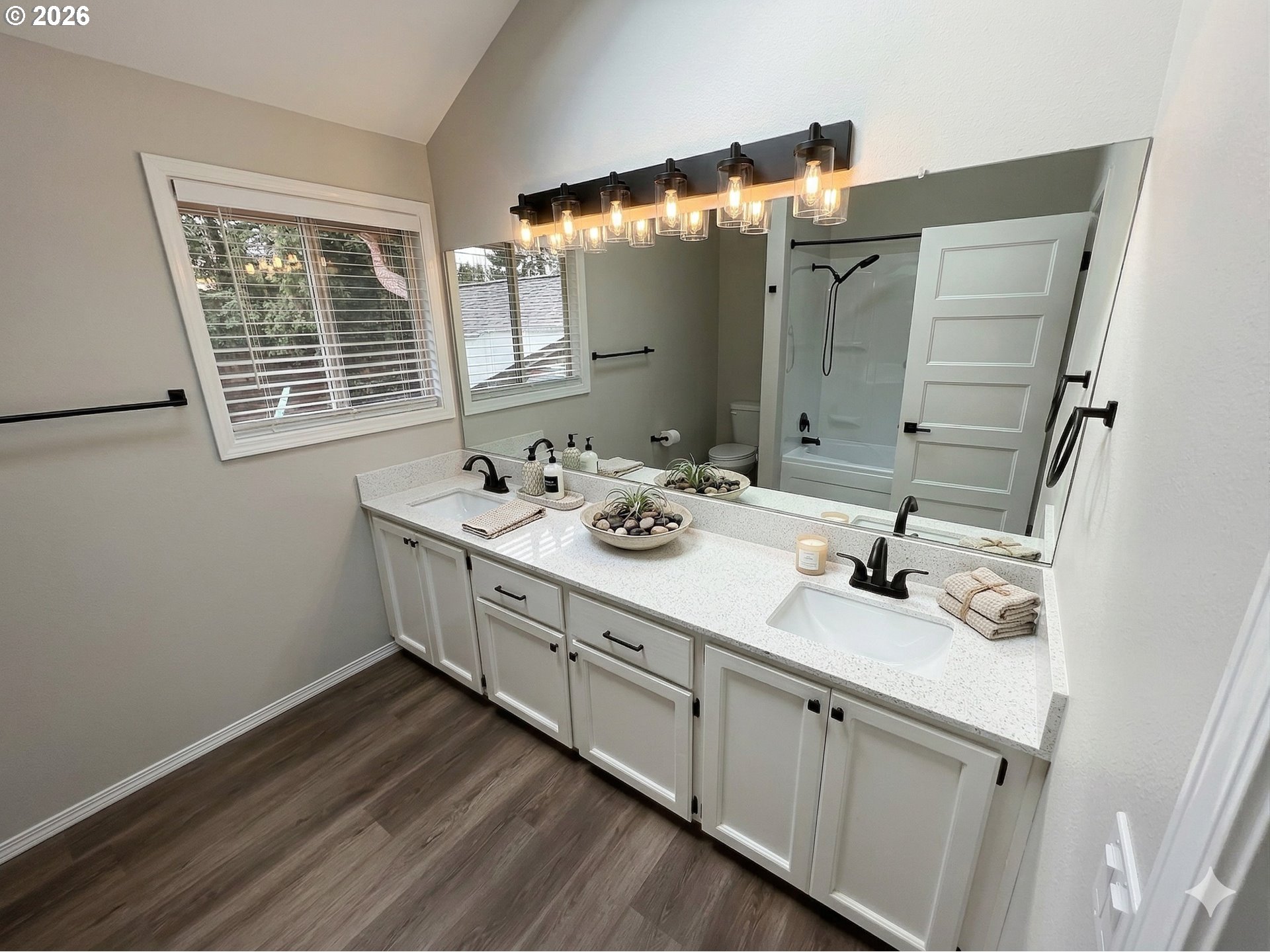 7025 Southwest 164th Terrace Beaverton, OR 97007 - Photo 7 of 28 a bathroom with a double vanity sink and mirror