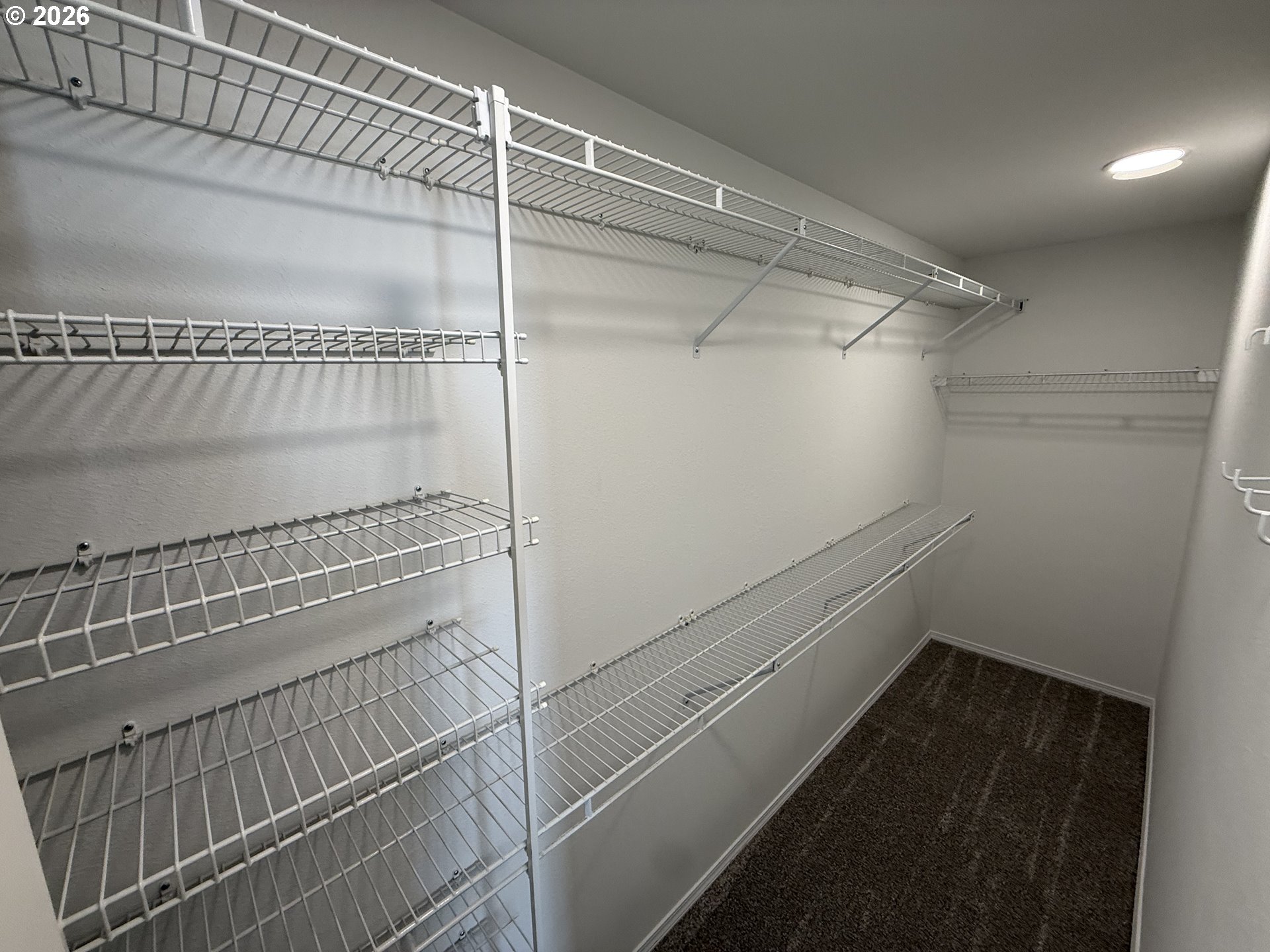 7025 Southwest 164th Terrace Beaverton, OR 97007 - Photo 9 of 28 a view of a room with racks on the wall