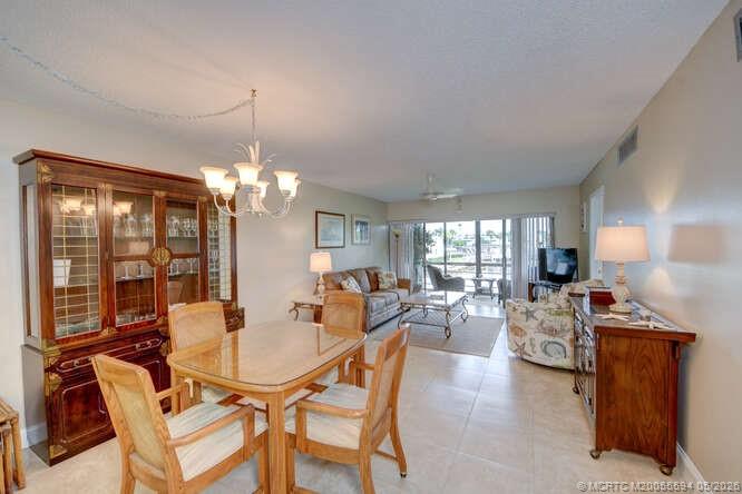 1950 Southwest Palm City Road, Unit 3209 Stuart, FL 34994 - Photo 6 of 64 Dining and living area.