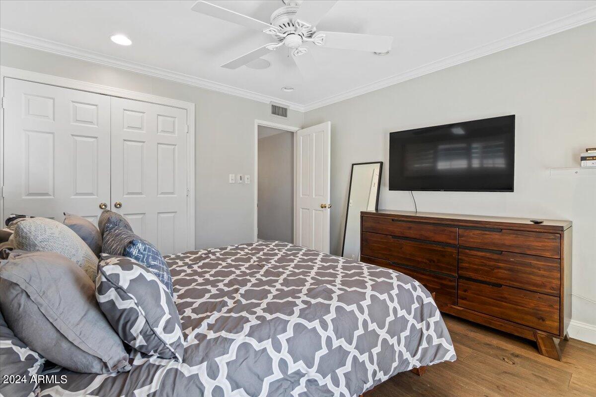 3841 East Elm Street Phoenix, AZ 85018 - Photo 42 of 72 a bedroom with a bed and a flat screen tv