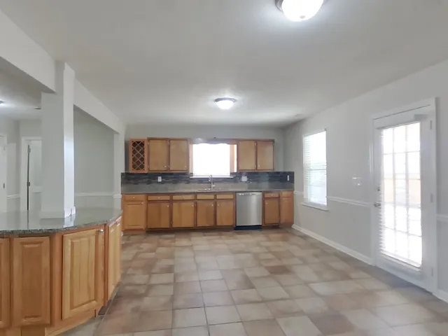 a large bathroom with a large tub and sink