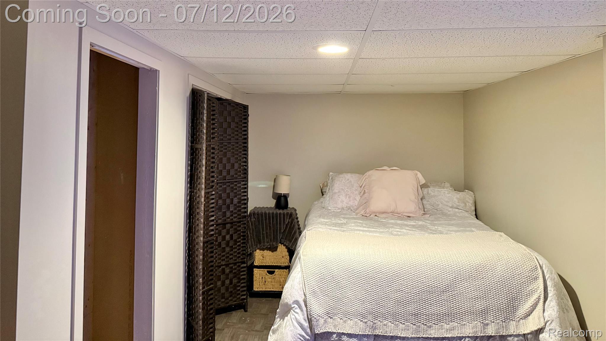2033 Avonstoke Road Rochester, MI 48307 - Photo 21 of 26 Recessed lighting illuminates a neutral-toned room with suspended ceiling tiles