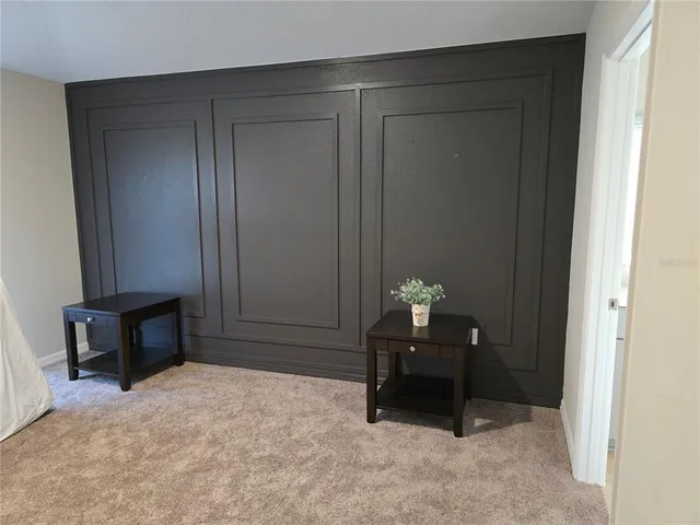 a room that has a dresser and a chair in it