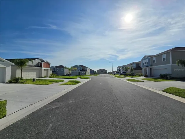 a view of a city street with a building in the background