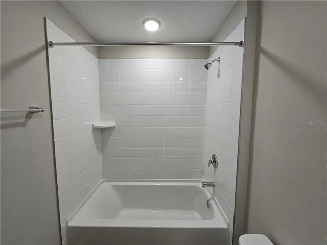 a close view of a bathtub in bathroom
