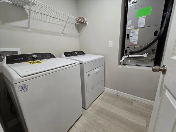 a utility room with dryer and washer