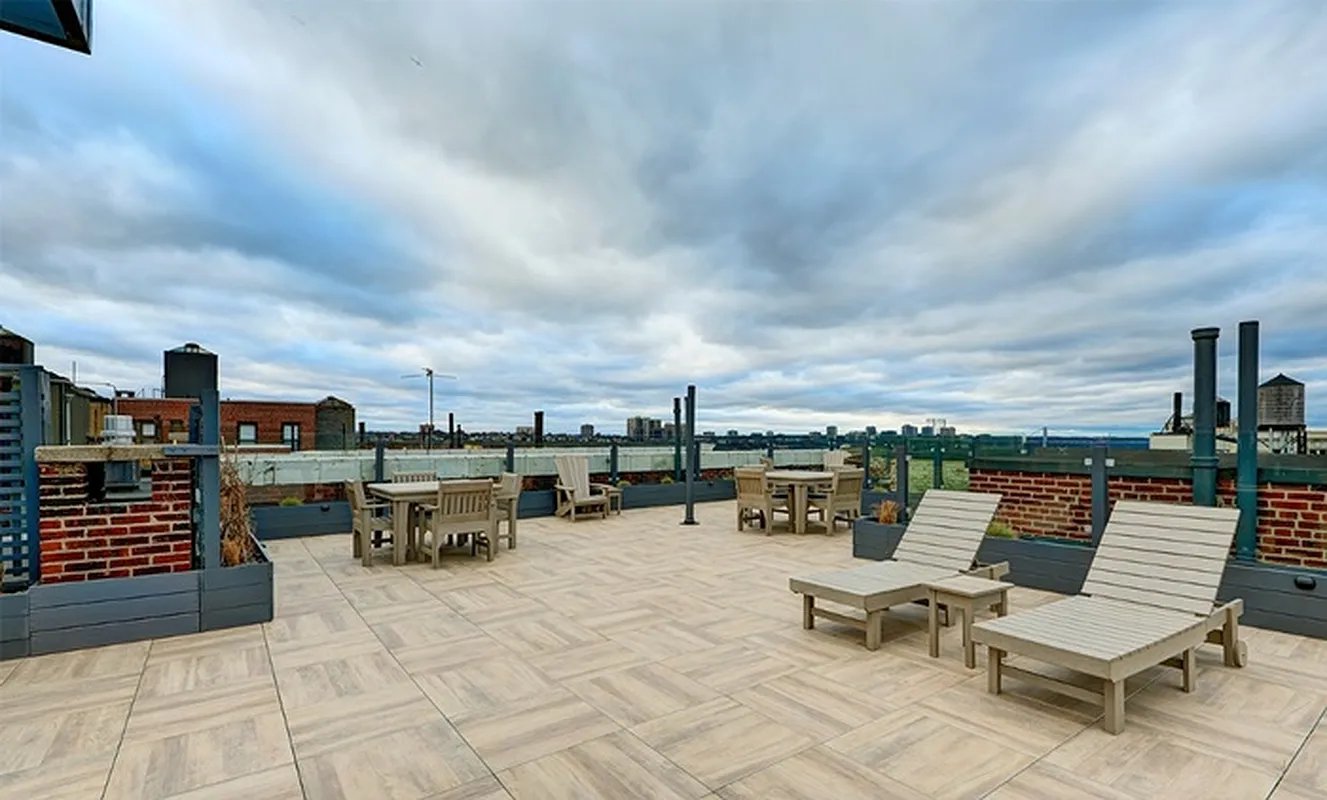 425 Riverside Drive, Unit 8G Manhattan, NY 10025 - Photo 13 of 16 an outdoor sitting area with furniture and city view