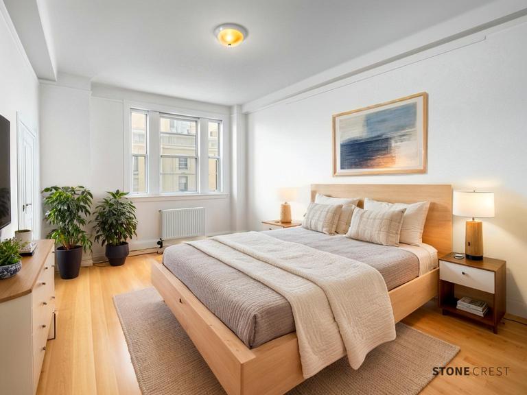 425 Riverside Drive, Unit 8G Manhattan, NY 10025 - Photo 5 of 16 a bedroom with bed and a potted plant