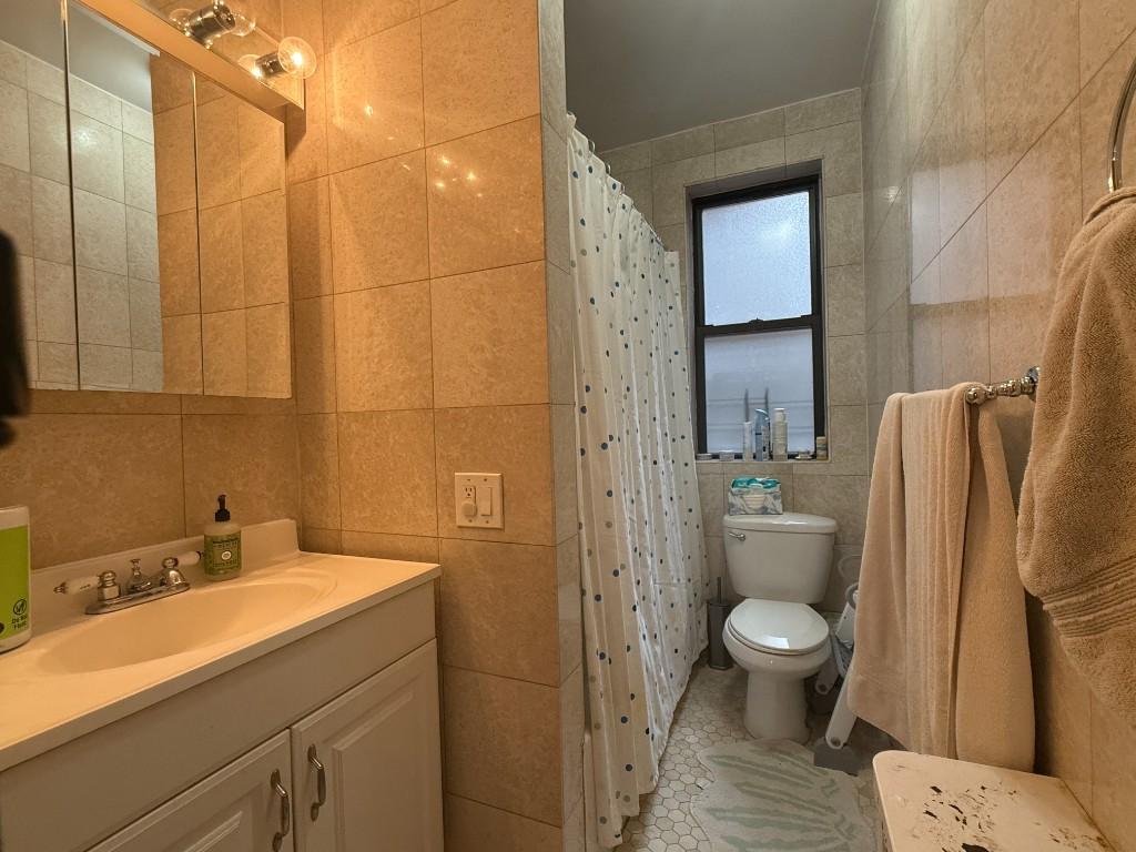 425 Riverside Drive, Unit 8G Manhattan, NY 10025 - Photo 6 of 16 a bathroom with a sink toilet and shower