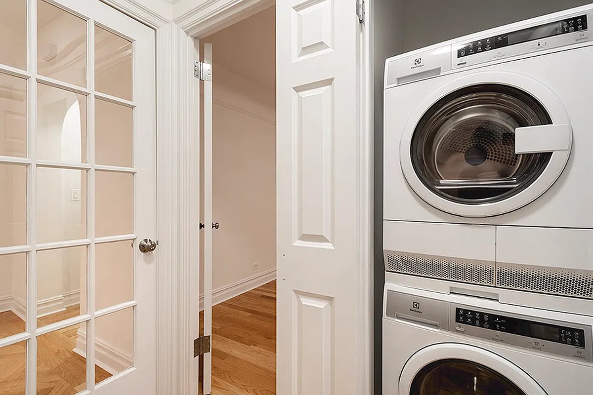 425 Riverside Drive, Unit 8G Manhattan, NY 10025 - Photo 7 of 16 a utility room with dryer and washer