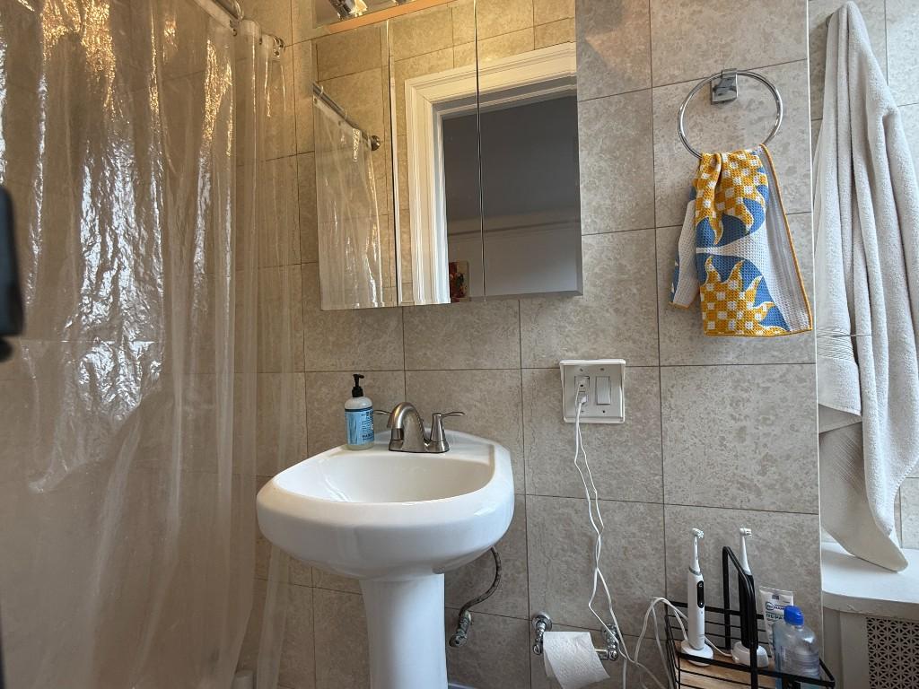 425 Riverside Drive, Unit 8G Manhattan, NY 10025 - Photo 9 of 16 a bathroom with a sink and mirror