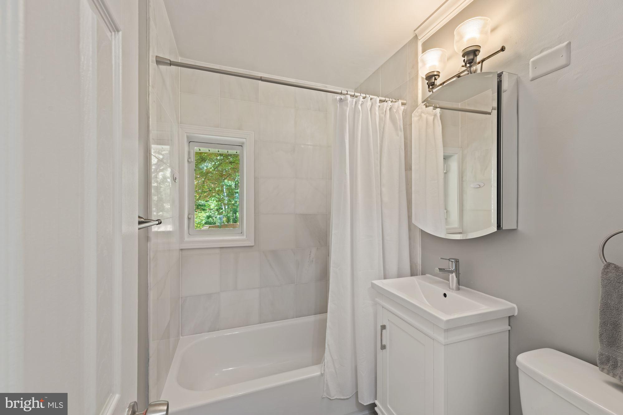 7016 Leesville Boulevard Springfield, VA 22151 - Photo 24 of 60 Full Bathroom #1 - Beautiful Tile Work Throughout!