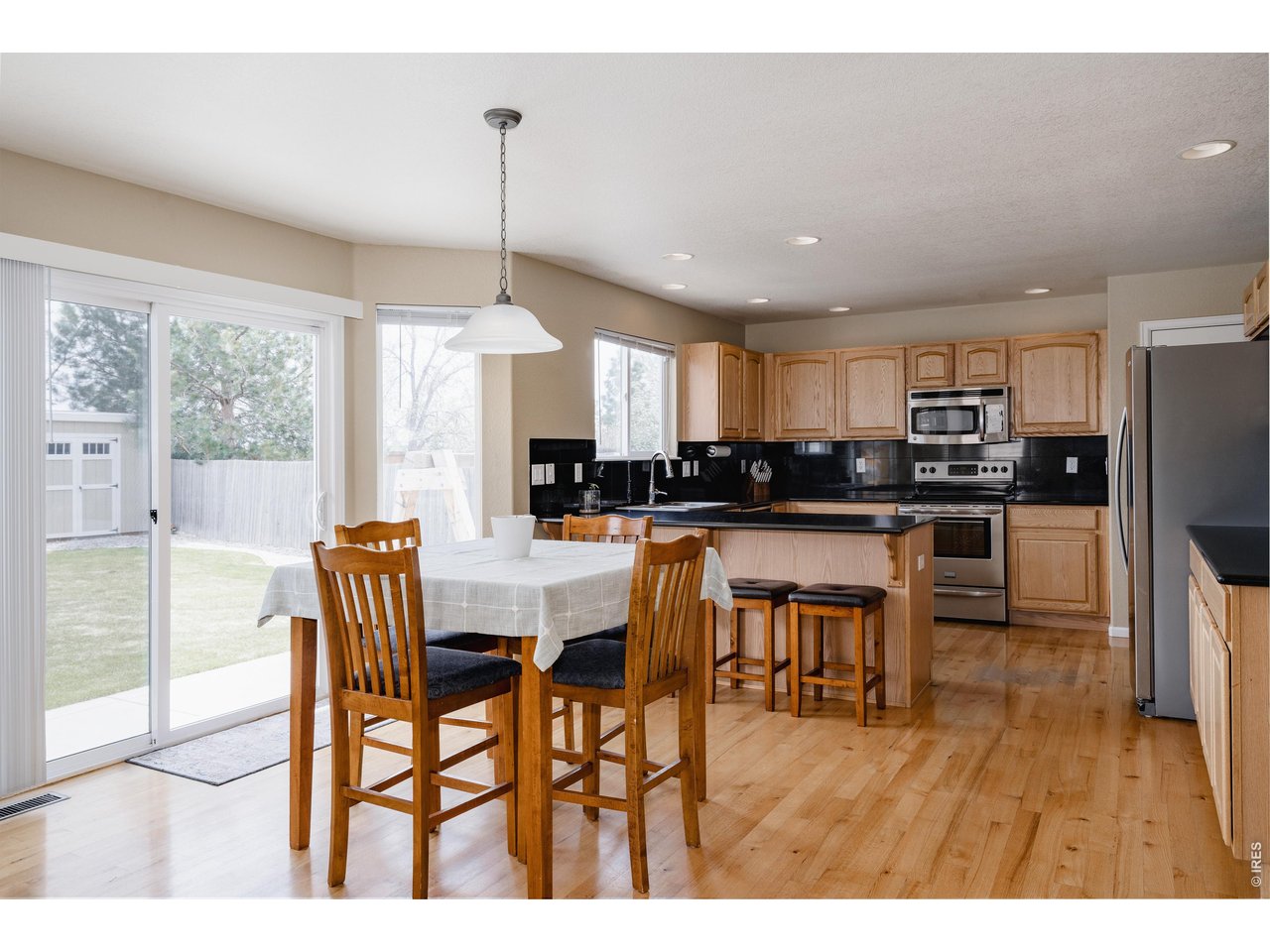 34 Saxony Road Johnstown, CO 80534 - Photo 7 of 49 Kitchen looks out onto amazing backyard