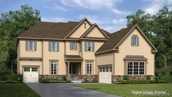 1362 Afton Way, Unit 123 Fort Mill, SC 29708 - Photo 1 of 5 a front view of a house with a yard and garage