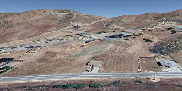 a view of a backyard with wooden fence