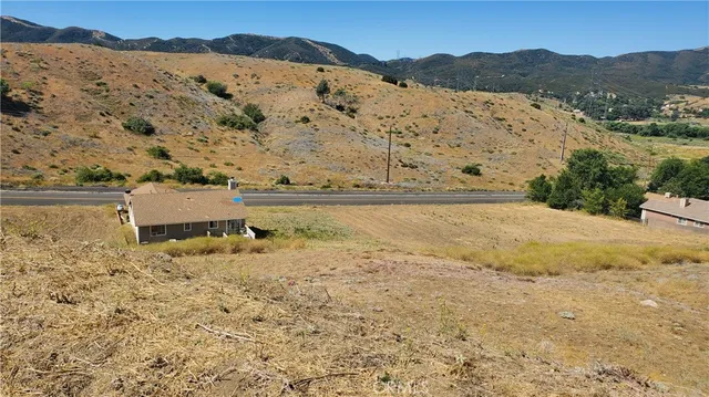 a view of ocean with a mountain