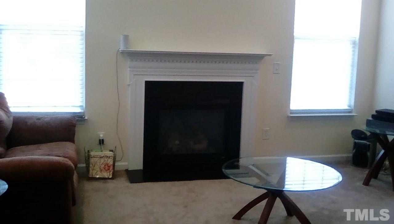 3701 Rivermist Drive Raleigh, NC 27610 - Photo 14 of 17 Gas logs help to create a warm and romantic atmosphere!