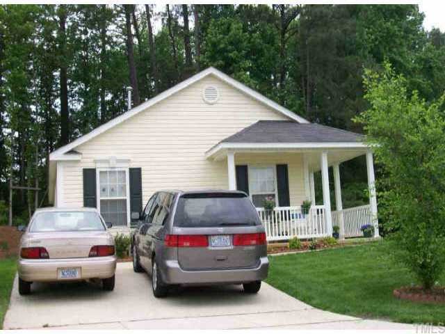 a view of a car parked in front of house