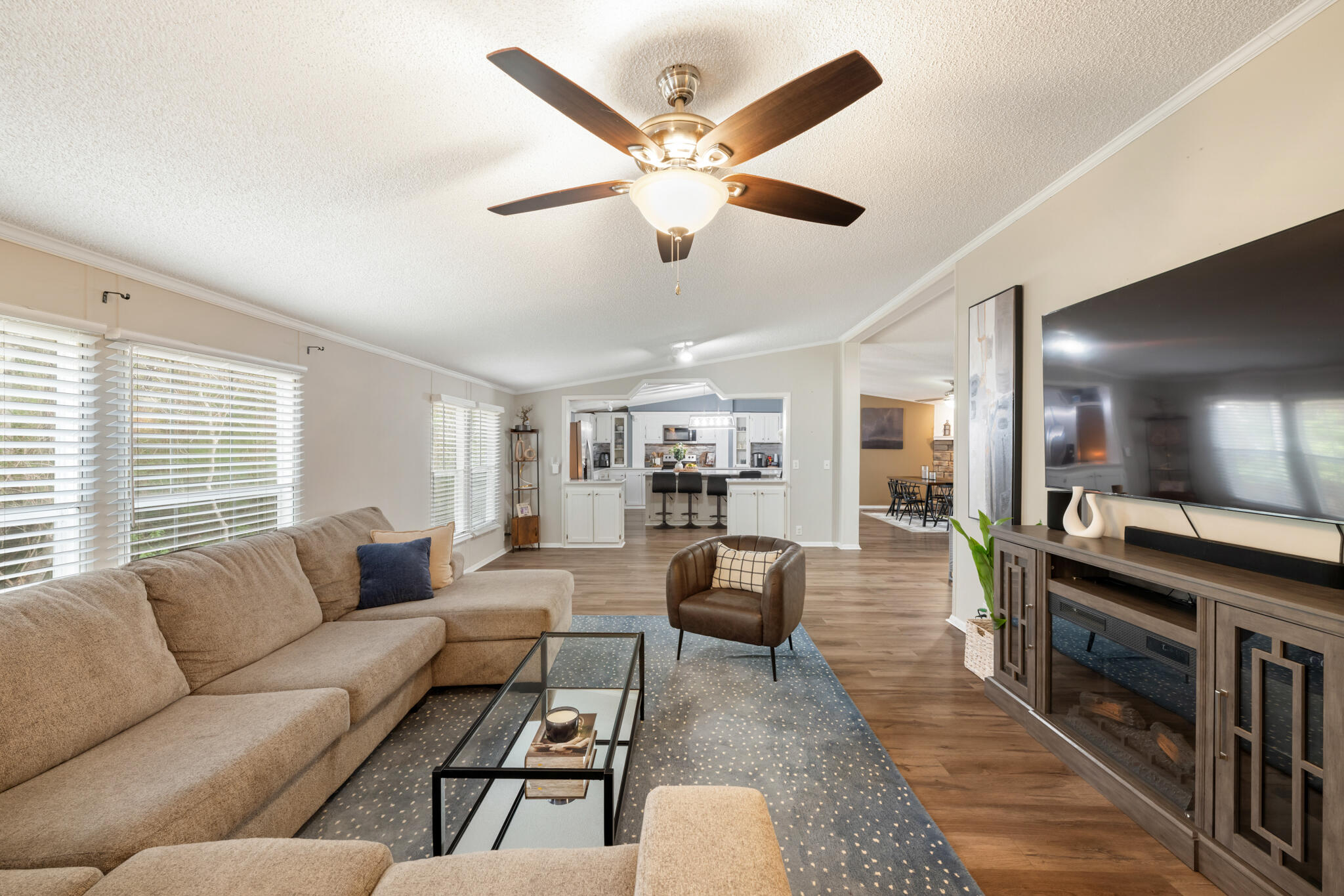 2422 Crescent Wood Road Navarre, FL 32566 - Photo 16 of 42 a living room with furniture and a large window
