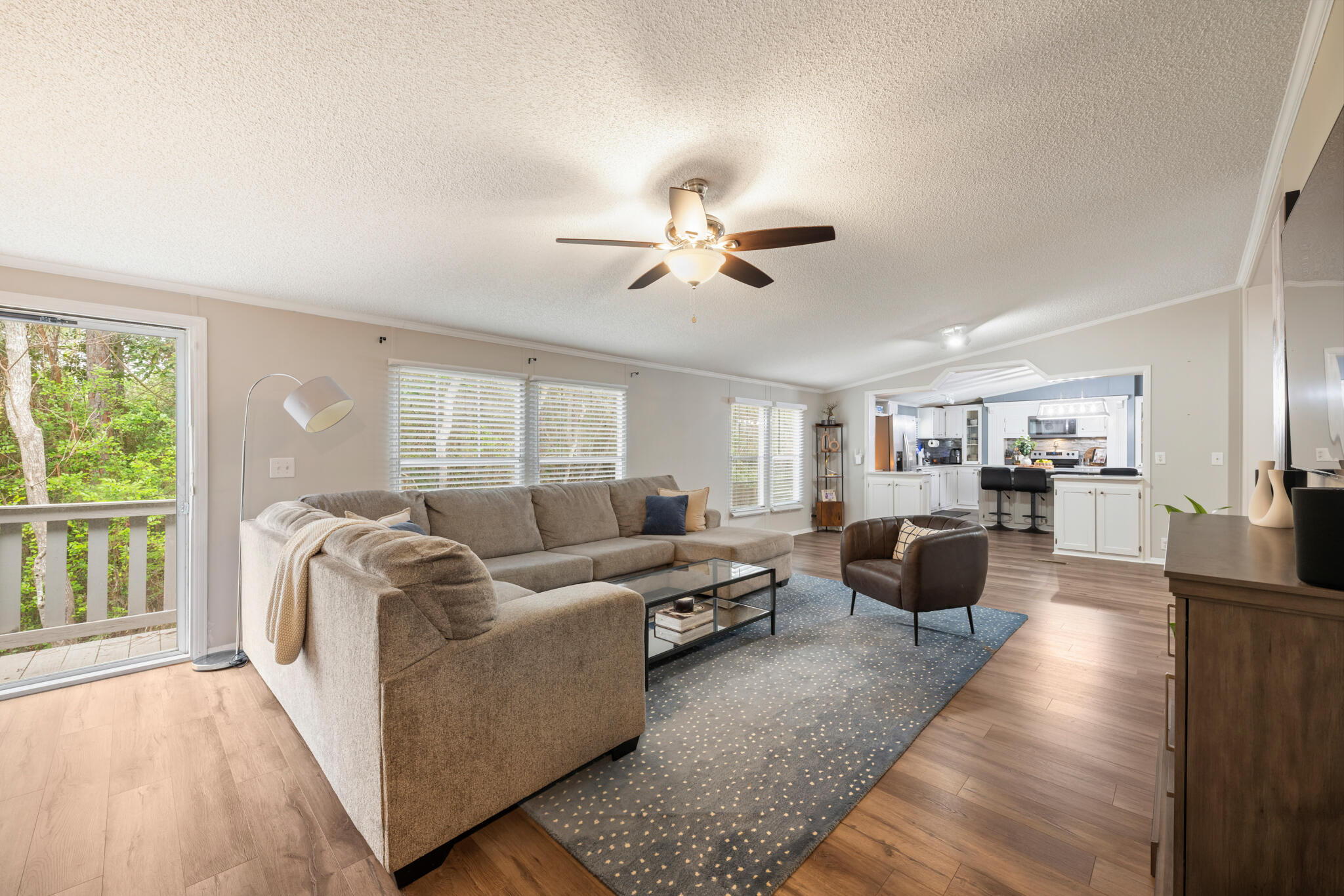 2422 Crescent Wood Road Navarre, FL 32566 - Photo 17 of 42 a living room with furniture and a large window