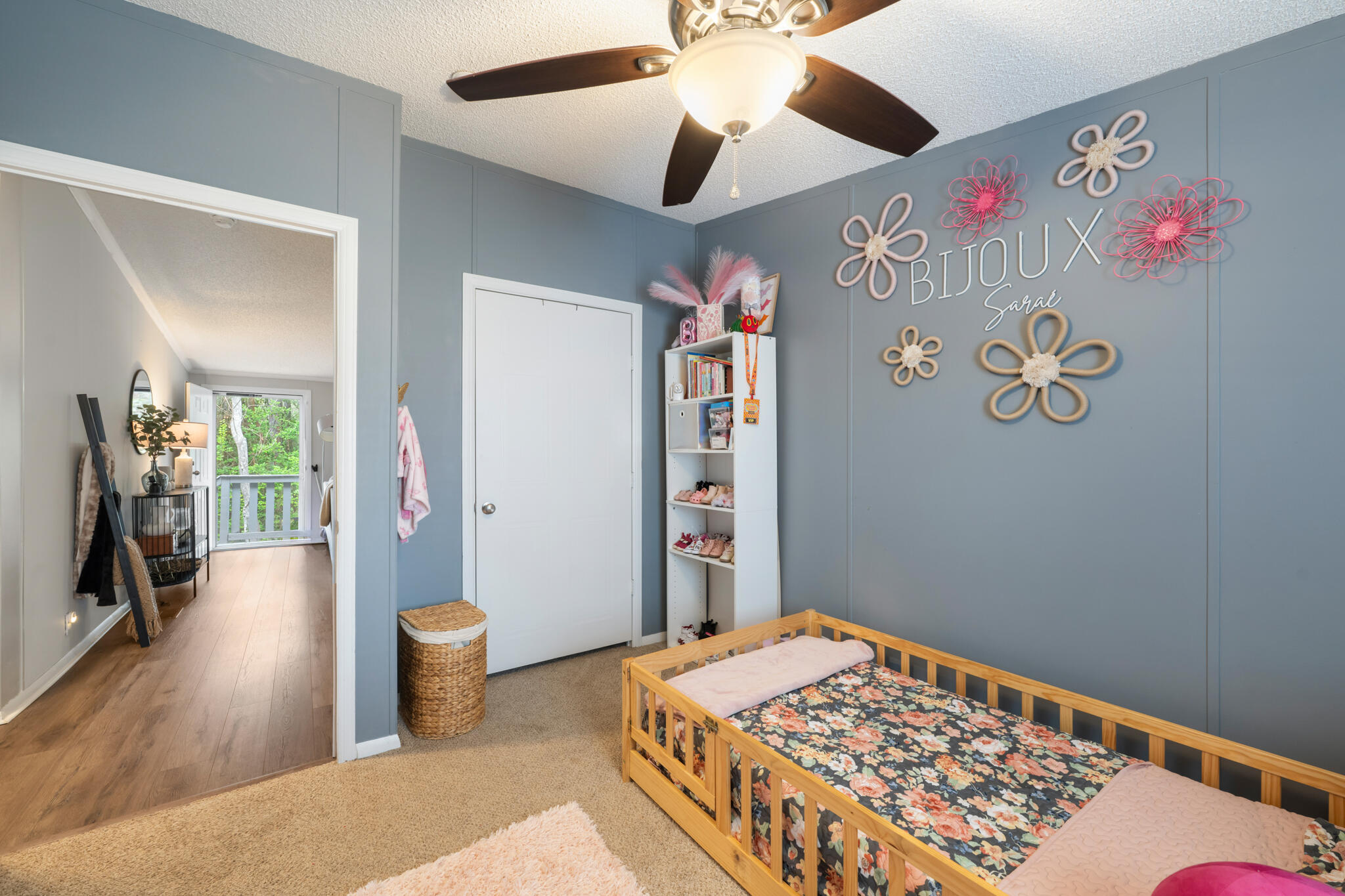 2422 Crescent Wood Road Navarre, FL 32566 - Photo 20 of 42 a bedroom with a bed and a chandelier