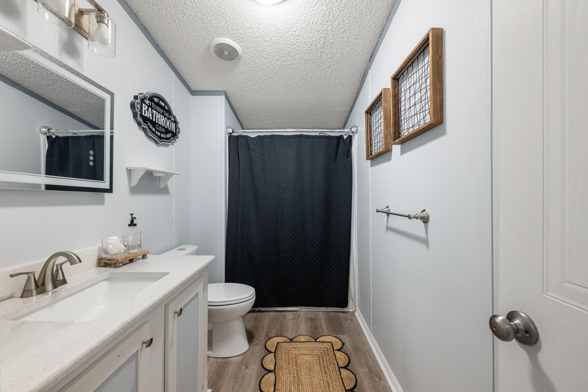 2422 Crescent Wood Road Navarre, FL 32566 - Photo 23 of 42 a bathroom with a granite countertop sink toilet and shower