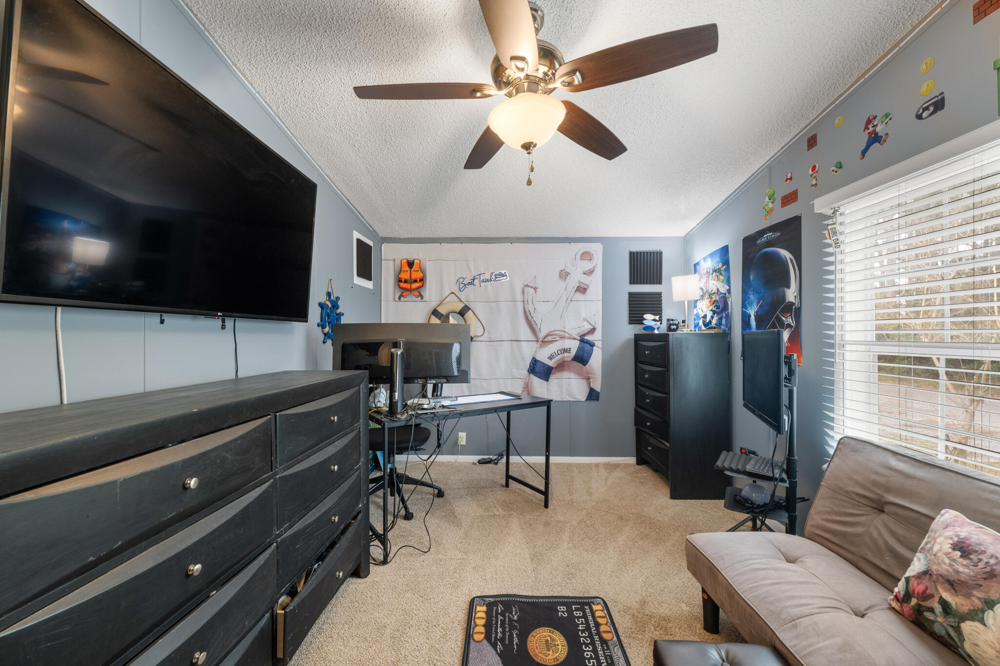 2422 Crescent Wood Road Navarre, FL 32566 - Photo 26 of 42 a view of a livingroom with furniture and a flat screen tv
