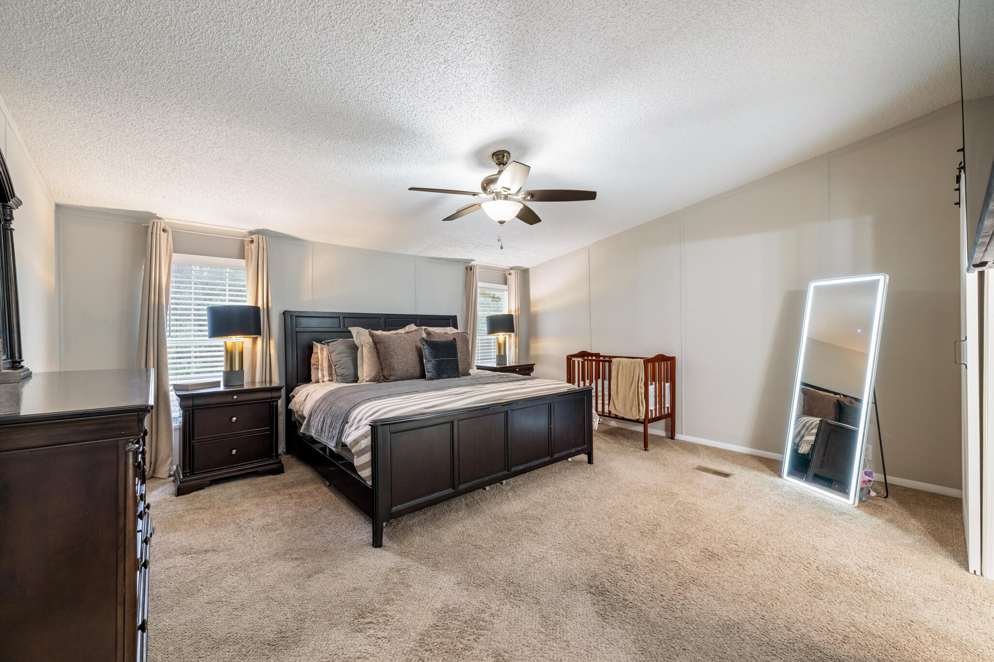 2422 Crescent Wood Road Navarre, FL 32566 - Photo 28 of 42 a bed room with a bed and a ceiling fan