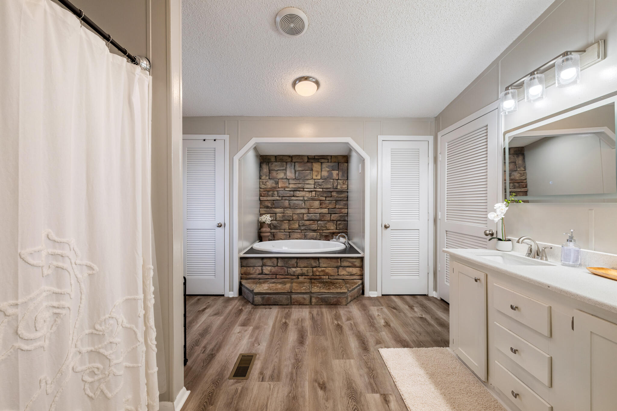 2422 Crescent Wood Road Navarre, FL 32566 - Photo 31 of 42 a bathroom with a sink and a mirror