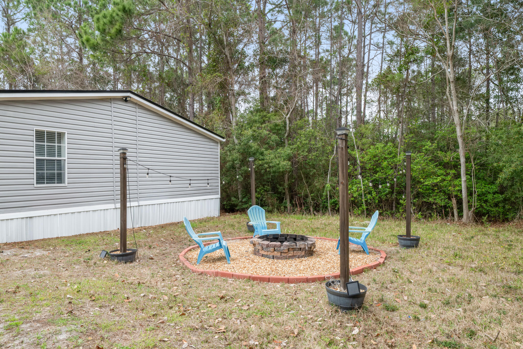 2422 Crescent Wood Road Navarre, FL 32566 - Photo 38 of 42 a view of a house with backyard