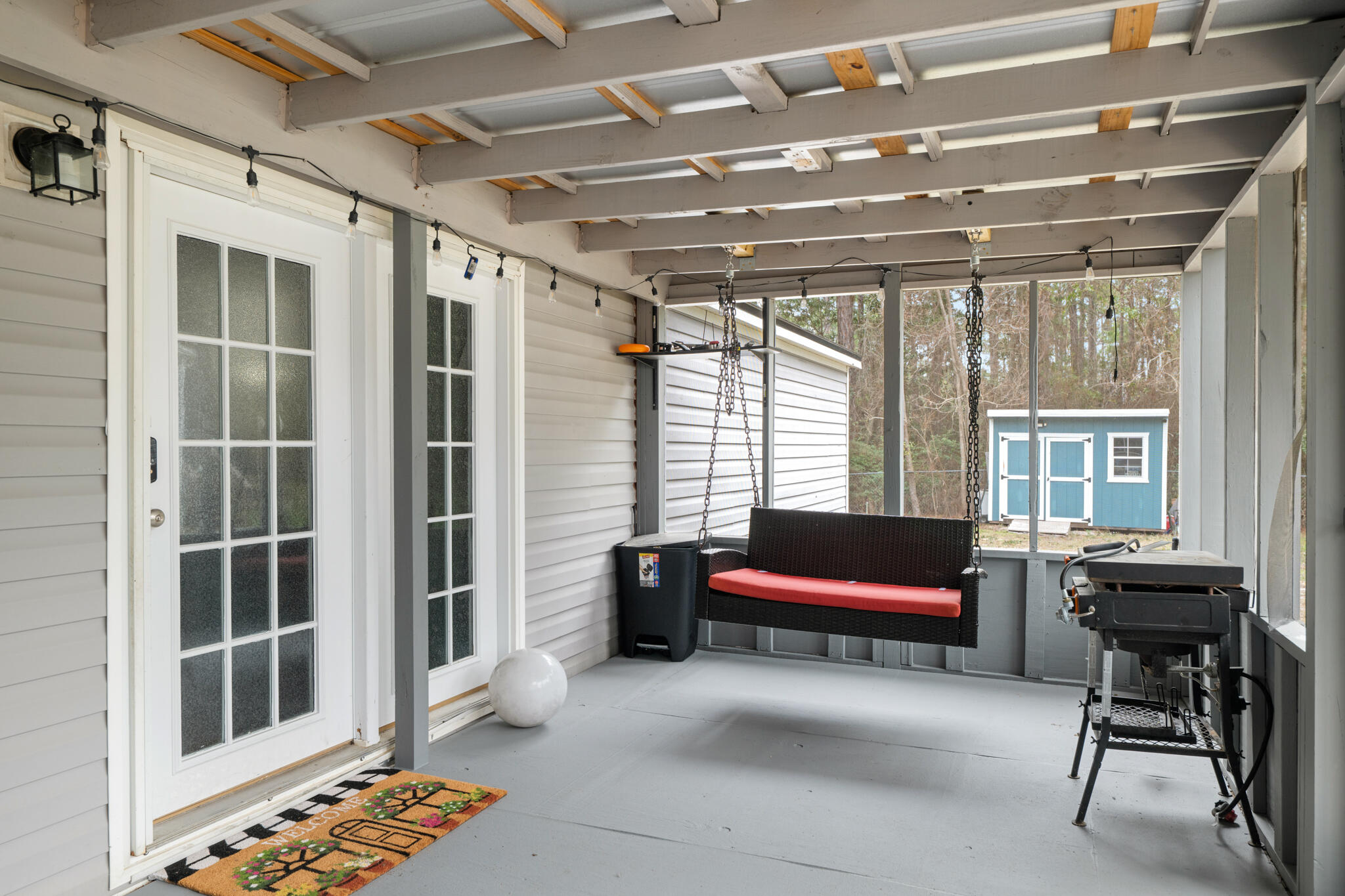 2422 Crescent Wood Road Navarre, FL 32566 - Photo 6 of 42 a outdoor space with lots of furniture and windows