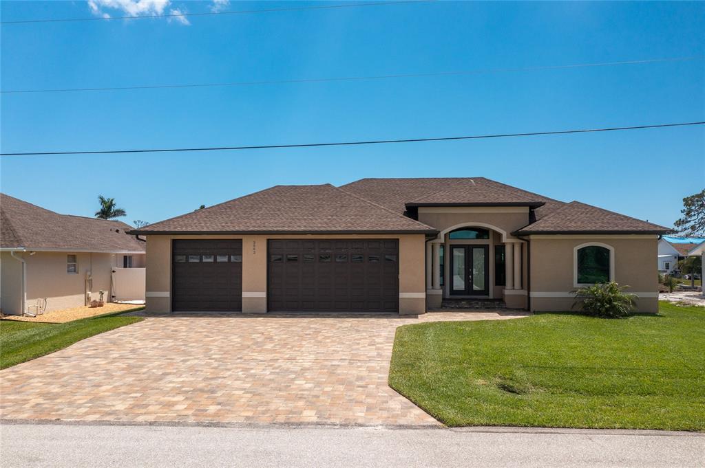 2582 Oberon Road Englewood, FL 34224 - Photo 1 of 1 Stunning ALMOST NEW WATERFRONT Home with Paver Driveway!
