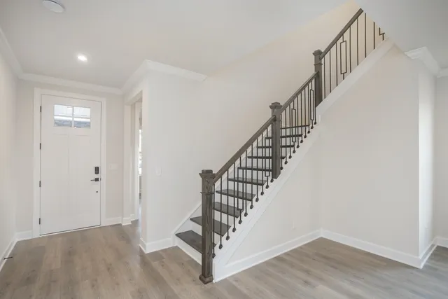 a view of entryway with wooden floor