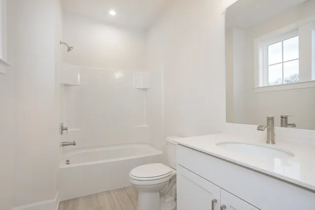 a bathroom with a sink a toilet and a bathtub