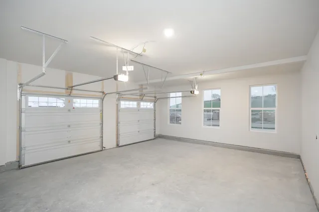 a view of an empty room with windows