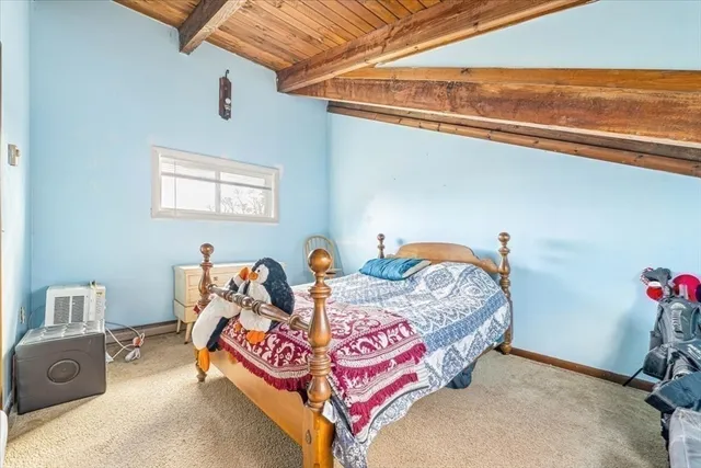 a bedroom with bed and a window