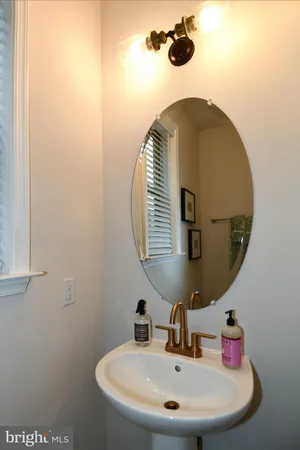 a bathroom with a sink and mirror